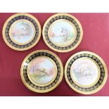 Set of four A. Prevot Limoges circular cabinet plates printed and enameled to centre with exotic