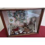 Framed and glazed cabinet diorama depicting a Victorian sitting room interior with collectables