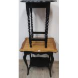 Edwardian ebonised two tier occasional table with waxed shaped top on angular supports joined by a