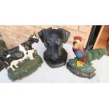 Composite figure of a dogs head, cast metal cockerel doorstop and similar Friesian cow doorstop (3)