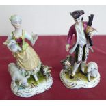 Pair of Dresden porcelain figures of shepherd and his lass with sheepdog and sheep, blue printed