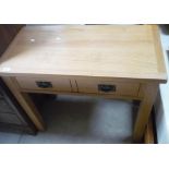 Modern light oak two drawer side table on square supports (90cm x 45cm x 77cm)