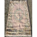 20th C Artisan made Oriental design chainstitch wool rug, pink ground with central floral motif