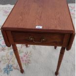 Oak Pembroke table, with two fall leaves and figured drawer with brass handle, on turned tapering