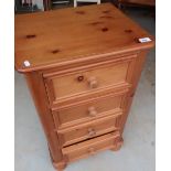 Modern pine chest of four drawers on turned bun feet (48cm x 39cm x 80cm)