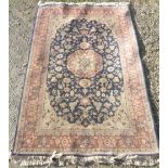 20th C blue and cream ground Persian pattern rug, central floral medallion with floral pattern