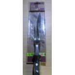 Sealed as new Taylor's Eye Witness carving knife and associated carving fork