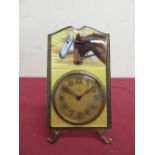 Enamel and silver gilt faced 8 day mantel clock with pair of horses heads on yellow enamel backgrou