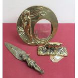 Art Nouveau brass circular easel picture frame decorated in relief with a nude female figure with