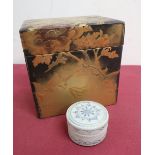 Japanese lacquer rectangular tea caddy, decorated in relief and gold with trailing foliage and