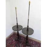 Pair of Regency style mahogany standard lamps with adjustable brass columns above galleried circular