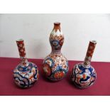 A pair of Japanese Imari pattern mallet shaped vases (H18cm), similar double gourd shaped vase. (