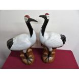 A pair of Japanese ceramic figures of cranes, with impressed signature panels to the base (H51cm)