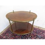 Regency style brass gueridon table two cross-banded oval tiers on turned supports with pineapple