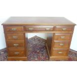 Edwardian walnut pedestal desk, figured top with inset gilt tooled red leather writing surface above