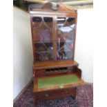 Regency mahogany secretaire bookcase, draught turned moulded scrolled cornice above a pair of