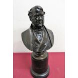 A cast bronze bust of a 19th C gentleman on circular base, the reverse marked C Marochetti, on