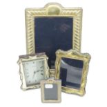 Silver hallmarked rectangular easel picture frame (26cm x19cm), a similar smaller frame (14cm x