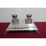 20th C continental silver rectangular inkstand, the two clear glass wells with hinged silver tops,