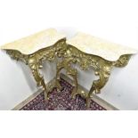 A pair of late 19th C giltwood console tables, serpentine shaped Sienna marble tops above a