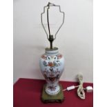 Armorial ceramic vase converted to electric table lamp with elaborate brass base (cracks to rim) (