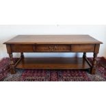 Reprodux oak rectangular coffee table with moulded top and frieze drawer on baluster supports joined