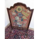 Queen Anne style figured walnut framed fire screen, with stepped arched moulded top, with a wool