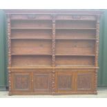 Large Victorian carved oak library bookcase, raised back with moulded cornice, mask and scroll