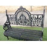Ornate cast metal garden bench with arched back, eagle wing arms and head decoration