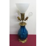 Large relief moulded baluster blue glazed three light table lamp, gilt metal top cast with grape