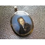 19th C large gold mounted pendant with a portrait of a lady in mourning with basket weave hair