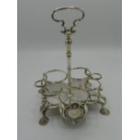 Geo. III hallmarked silver seven bottle cruet stand of shaped circular form with shield shaped