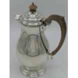 Geo. V hallmarked silver coffee pot with baluster body on stepped circular base with composition
