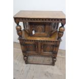Small 17th C style oak court cupboard, with lunette carved frieze and arch panel door with