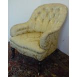 Victorian upholstered armchair, with deep buttoned curved back and downswept arms on turned supports