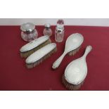 Two pairs of Geo. V engine turned silver hallmarked hairbrushes, Birmingham 1925, cut glass dressing