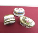 A oval circular porcelain table box with gilt mounts floral and gilt detail and central panel of