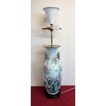 Large Chinese famille rose style table lamp with twin gilt handles and main body decorated with