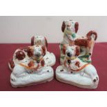 Pair of Staffordshire Spaniels with painted decoration and yellow collars, on oval bases (H7.5cm); a
