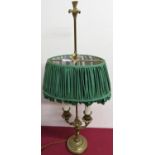 A gilt cast metal twin branch table lamp with adjustable height shade and circular base. (H70cm)