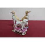 19th C English porcelain model of a poodle with a basket of flowers on a rectangular base with