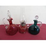 Victorian Cranberry and clear glass moon shaped decanter with loop handle, a similar turquoise