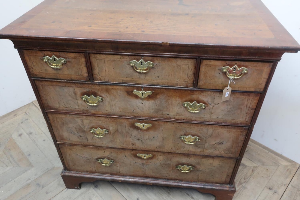 18th C cross and feather banded walnut chest with moulded top above three short and three long