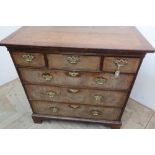 18th C cross and feather banded walnut chest with moulded top above three short and three long