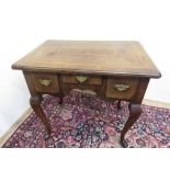 18th C Walnut lowboy with moulded feather banded top above three drawers with shaped apron on