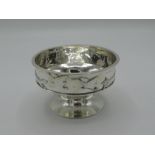Geo. V silver hallmarked hammered pedestal circular bowl, the rim with fox chasing goose in