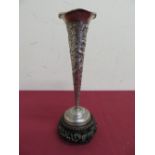Burmese style white metal trumpet shaped vase, decorated with dragons within floral scene above