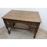17th C style oak kneehole desk, hinged top with fitted interior above two real and two faux
