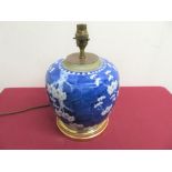 Oriental blue and white Prunus blossom pattern ginger jar converted into table lamp, with circular