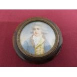 A turned walnut circular snuff box, the lid with a miniature portrait of a gentlemen on ivory-